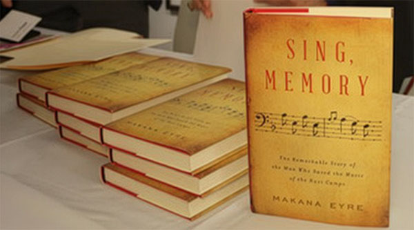 stack of "Sing, Memory" at book signing