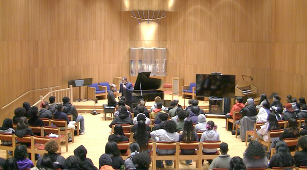 Elad Kabilio speaking at Concert for Williamsburg High School for Architecture and Design